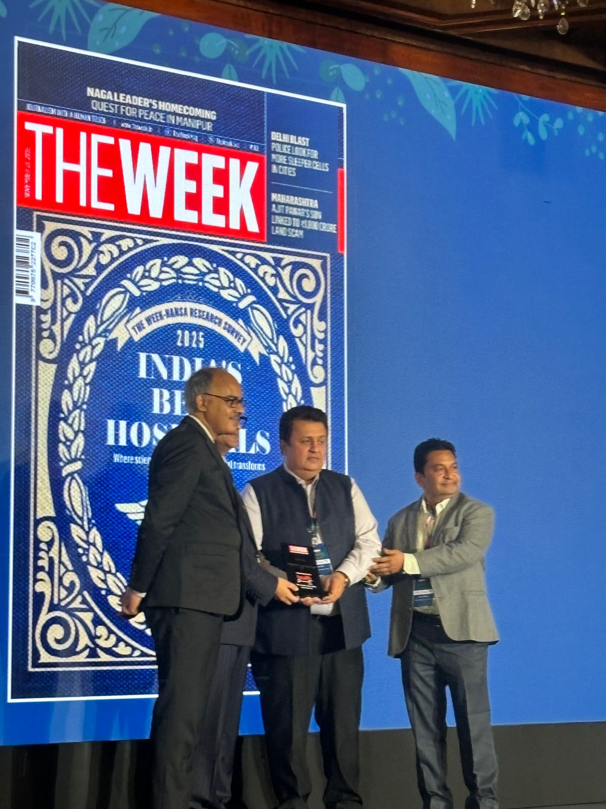 Executive Director Mr. Manav Teli and Director Mr. Vijay Borkar of Lords Mark Industries Limited being felicitated by (L-R) Mr Stanley Thomas, Chief News Editor, The Week and Mr Riyad Mathew, Chief Associate Editor and Director.